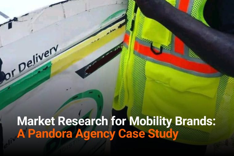 Field market researcher conducting in-person interview in Nigeria's urban mobility market